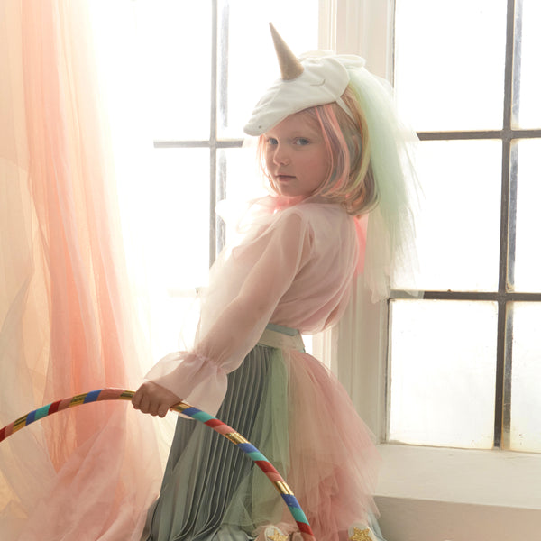 Our unicorn costume features a headpiece with a gold glitter horn rind rainbow tulle mane and a waistband with a rainbow tulle tail.