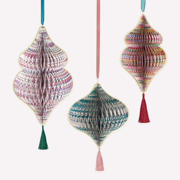 Our large Christmas decorations feature 3D honeycomb details, Liberty print designs in rich seasonal colors, tassels and satin ribbons. Image1