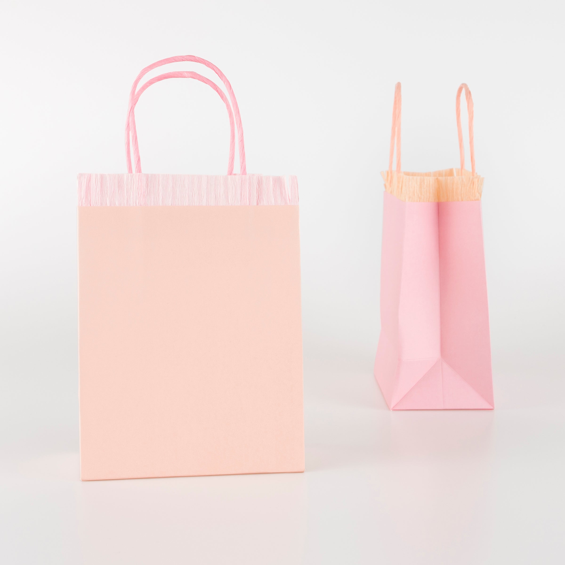 Our pink fringed bags are perfect as paper gift bags and party gift bags.