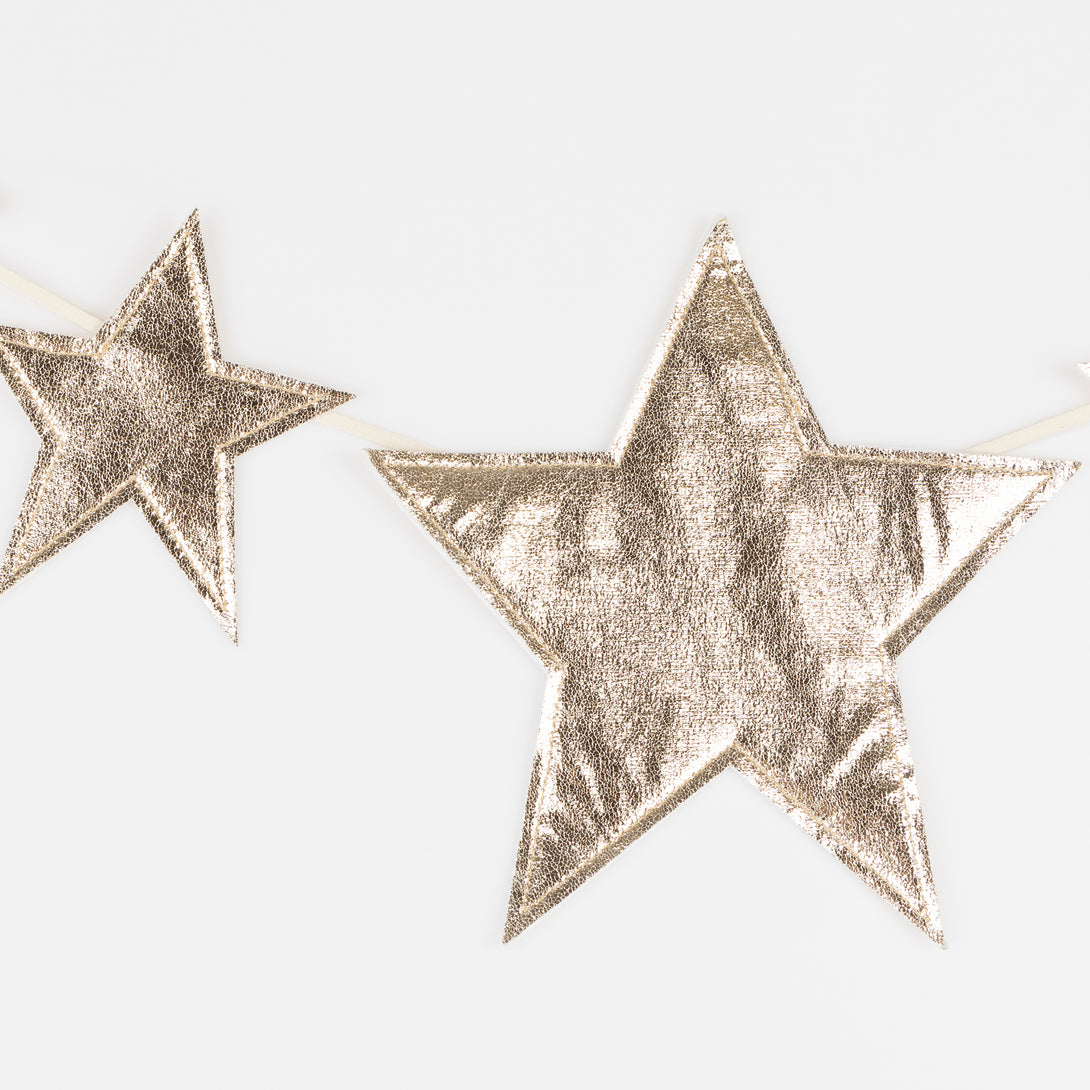 Our gold garland, with sparkling faux leather stars, adds shimmer and shine to any celebration. Image3
