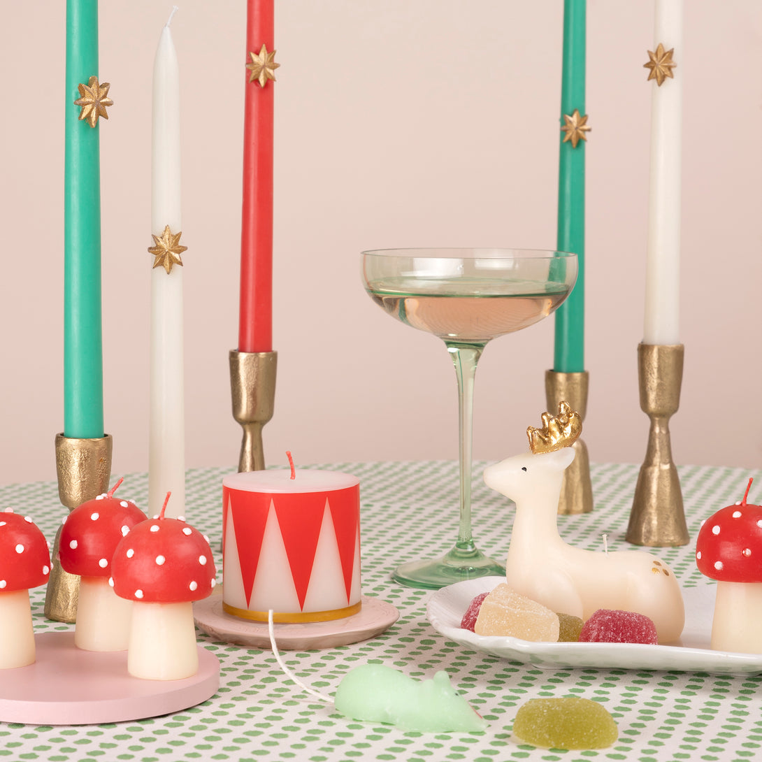 Our Christmas tall candles features gold wax stars and colored wicks for a sensational effect, a great host gift.