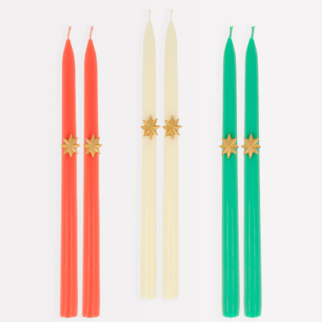 Our Christmas tall candles features gold wax stars and colored wicks for a sensational effect, a great host gift.