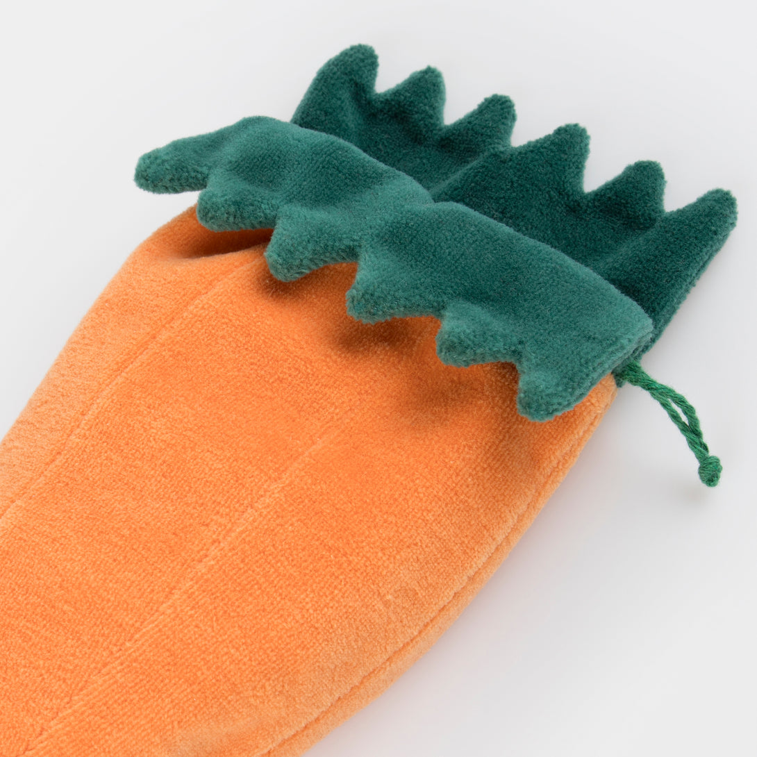 Our mini fabric bunny toy lives in a velvet carrot pouch for lots of imaginative fun.