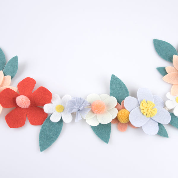 Our special party garland is crafted from felt, with flowers with pompom centers. Image4