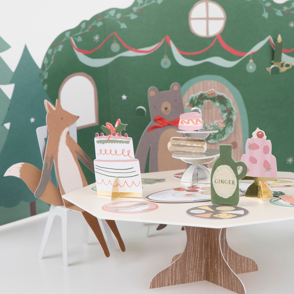 Tea party scene with a paper backdrop and woodland animals