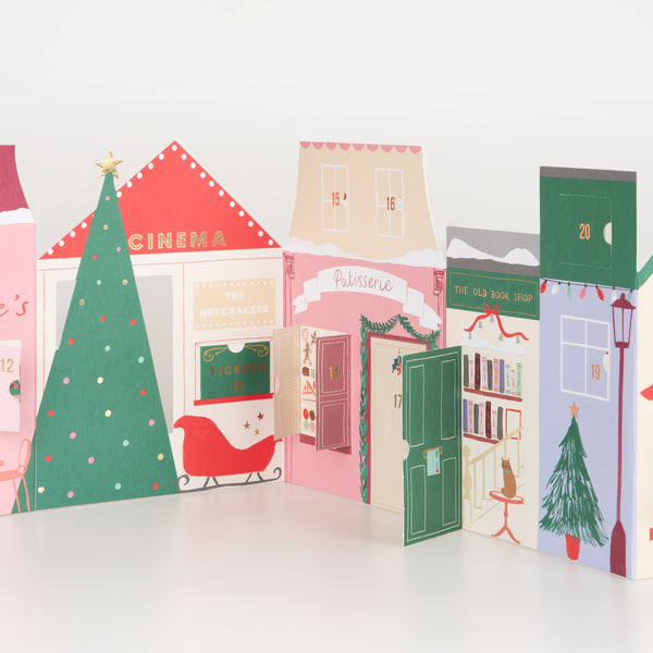 Our paper advent calendar is designed to look like Christmas street scene, with festive illustrations behind the windows and doors. Image4