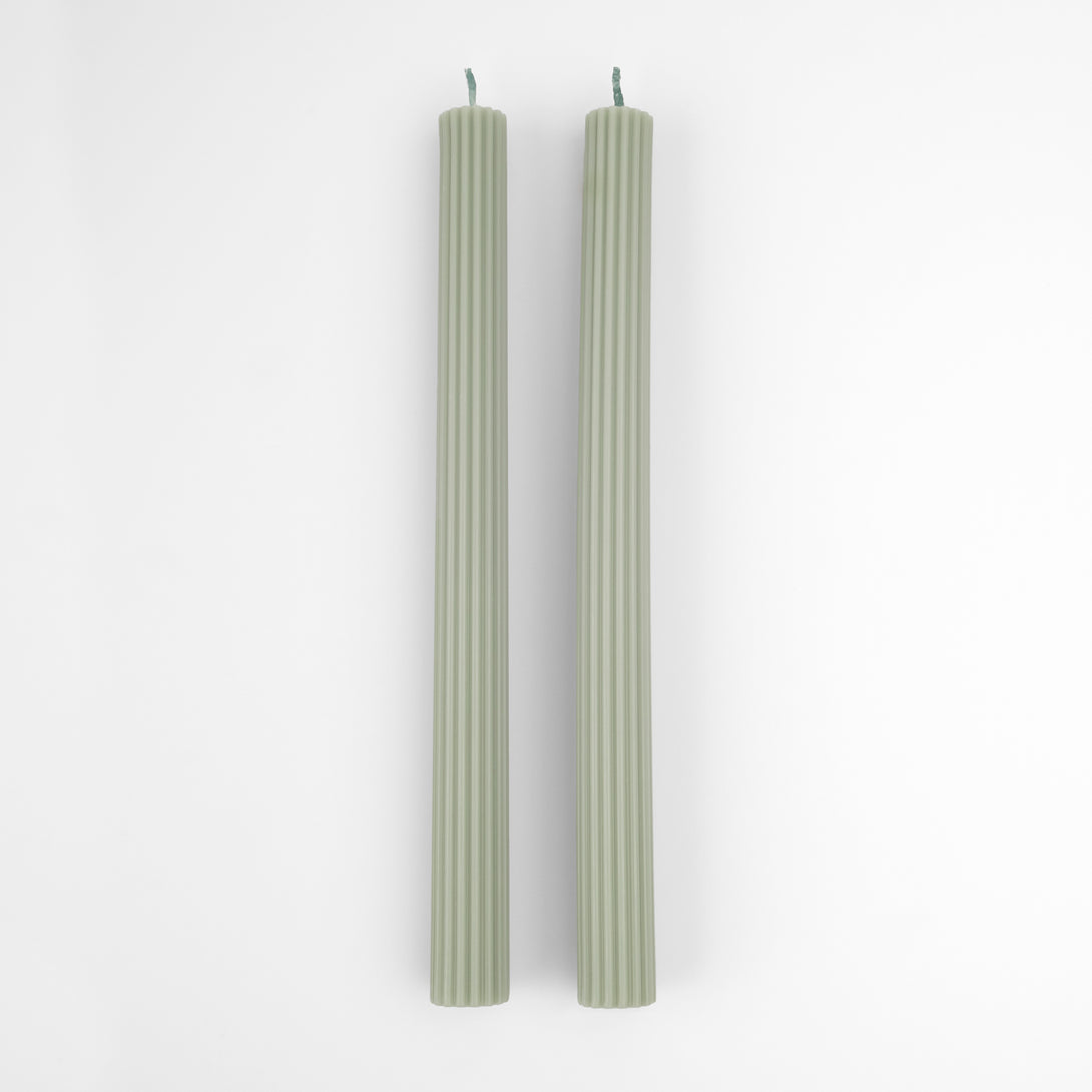 Our table candles, long with ridged details, are in a gorgeous green shade.