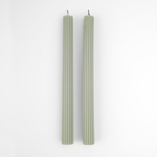 Our table candles, long with ridged details, are in a gorgeous green shade.