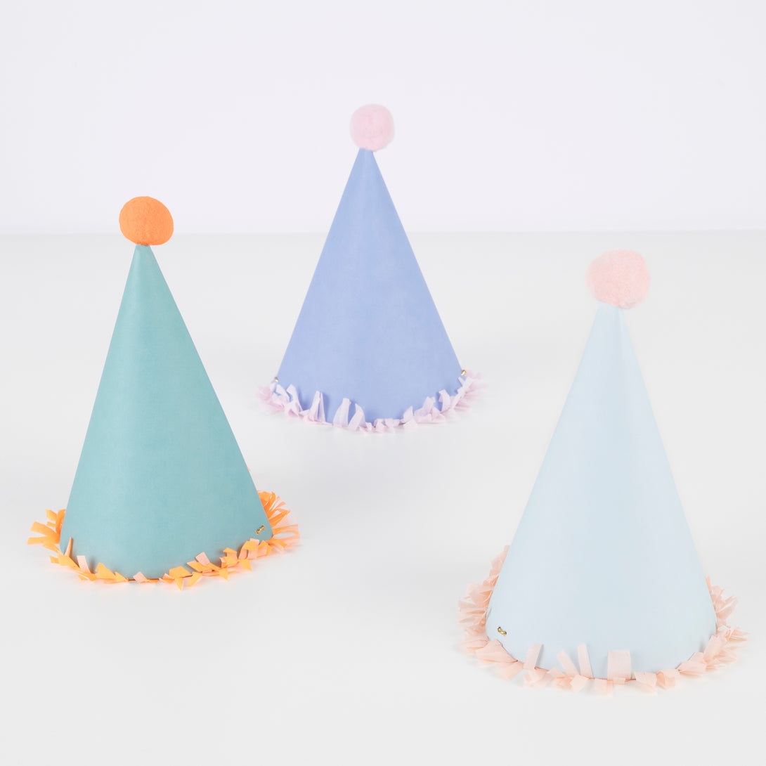 Our paper hats feature fringing, pompoms and bright colors.