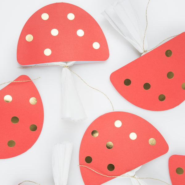 Our luxury Christmas crackers, in the shape of mushrooms, contain a red party hat, a joke and a fun enamel mushroom charm. Image5