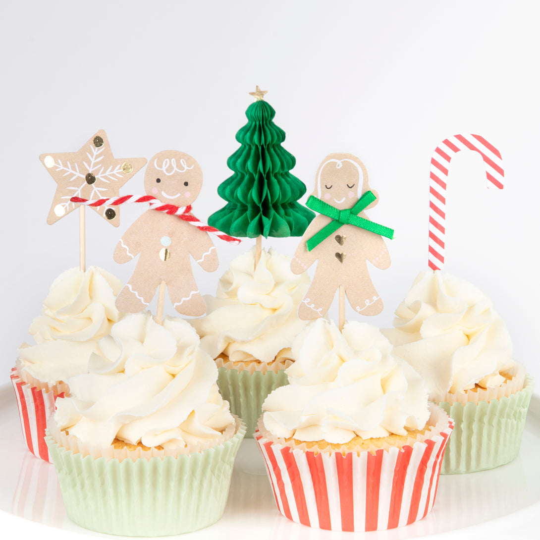 Our special Christmas party supplies include gingerbread house paper plates, party napkins, a cupcake kit and a fabulous festive garland.