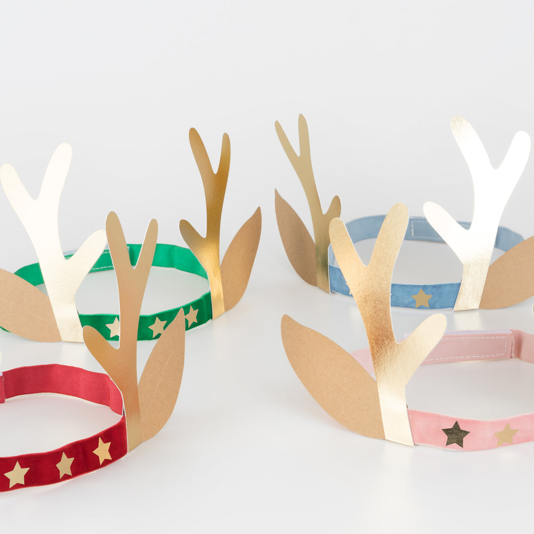 Our antler headbands, with velvet bands, shiny gold stars and antlers, and reindeer ears, make fun Christmas headwear.