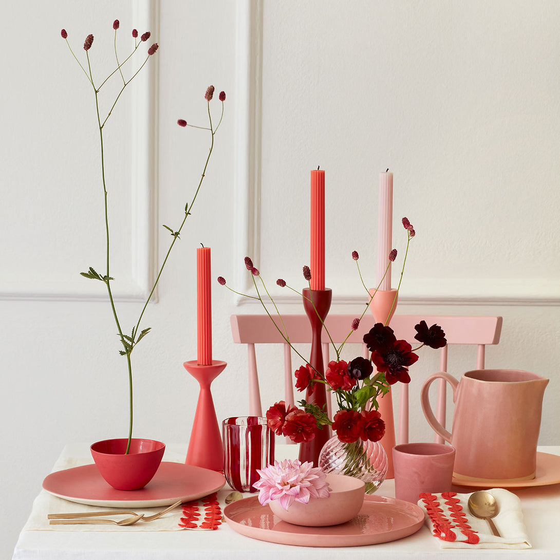 Our tall candles, in a pink color with ridged details, add a stunning look to any party.