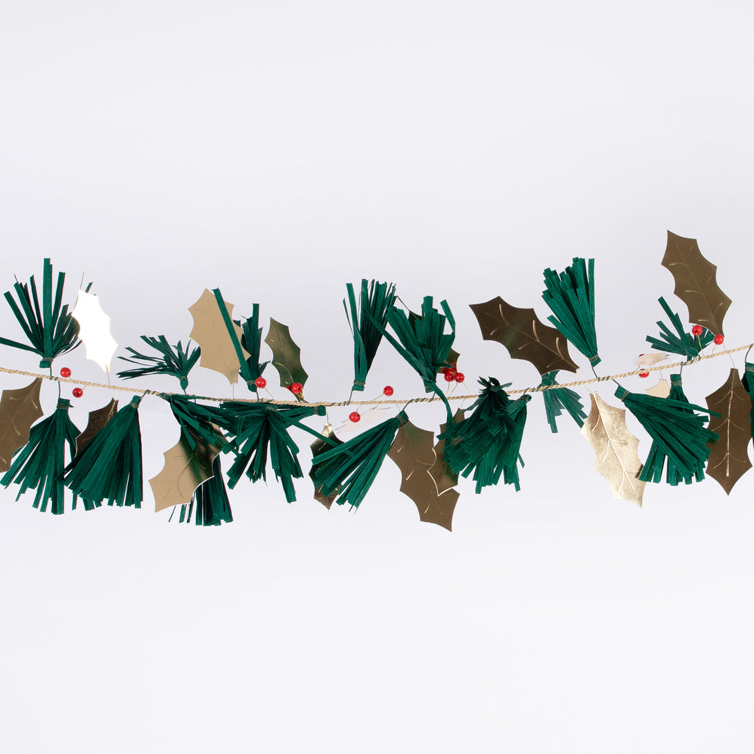 Our festive garland includes holly, berries and pine needles crafted from paper and wooden beads for a special Christmas foliage look.