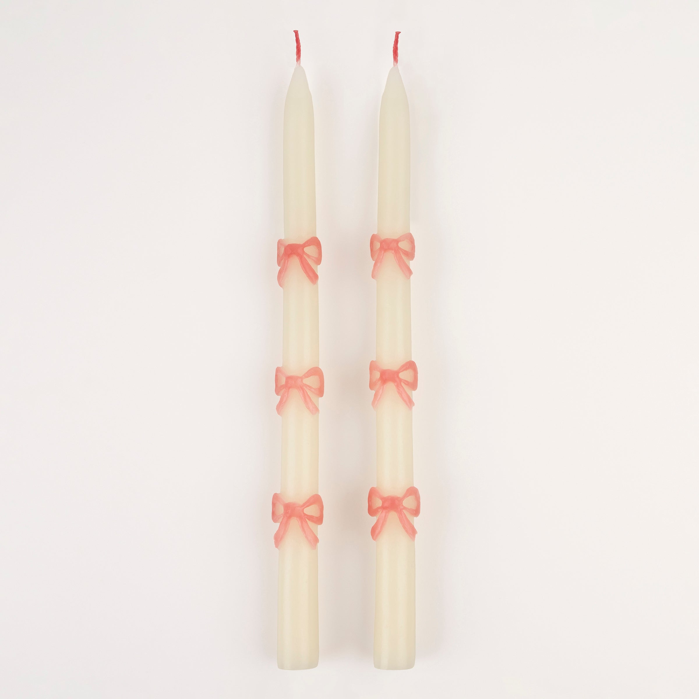 Our party candles feature handpainted pink bows and pretty pink wicks.