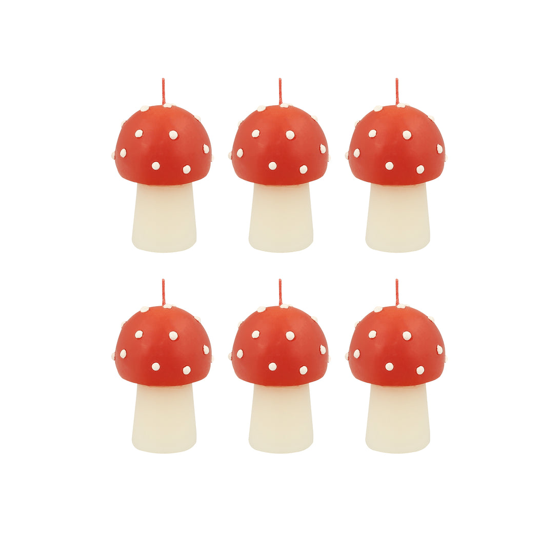 Our Christmas candles, are shaped like little mushrooms, in red and white with red wicks.