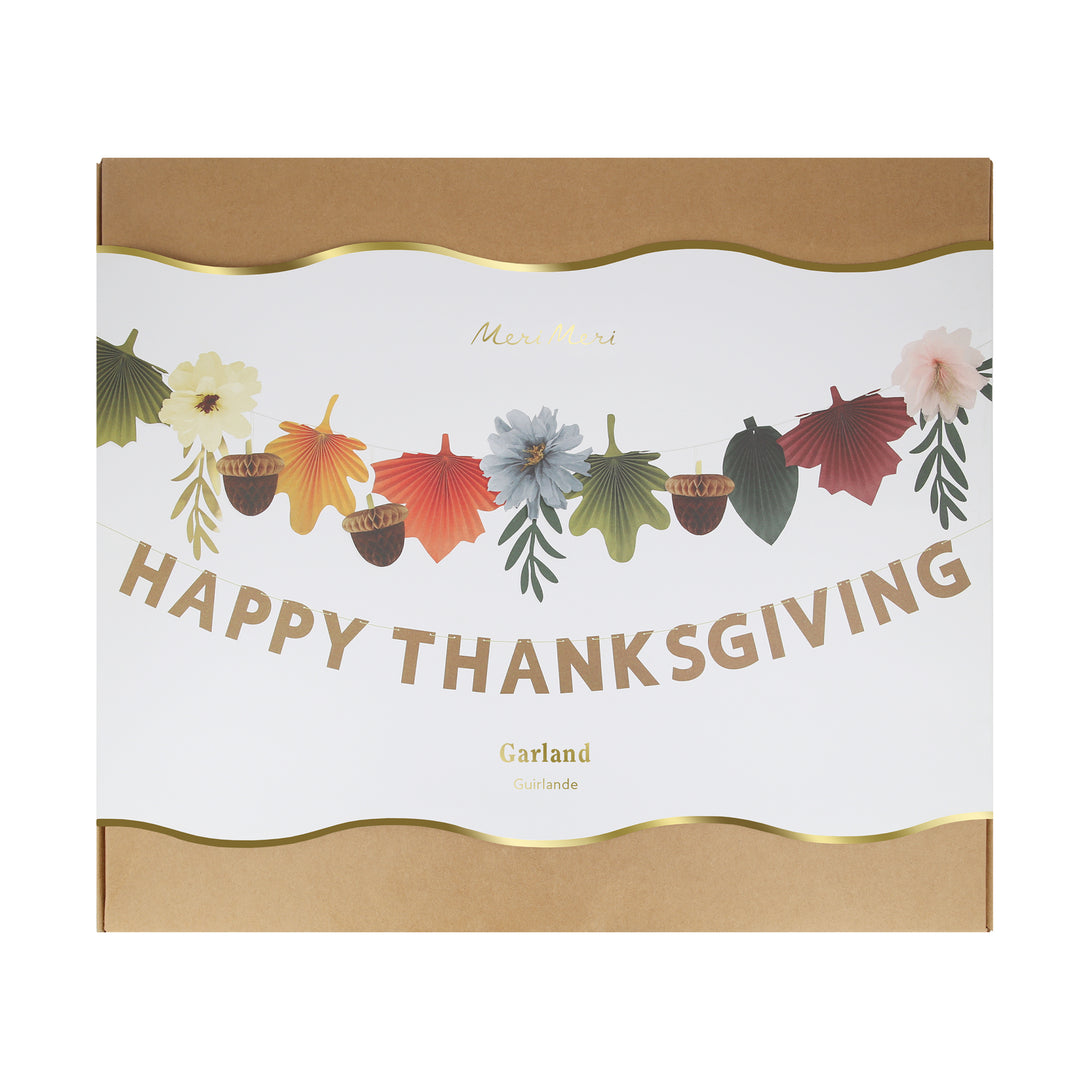 Our Thanksgiving garland has the perfect mix of fall leaves, paper flowers and the words Happy Thanksgiving.