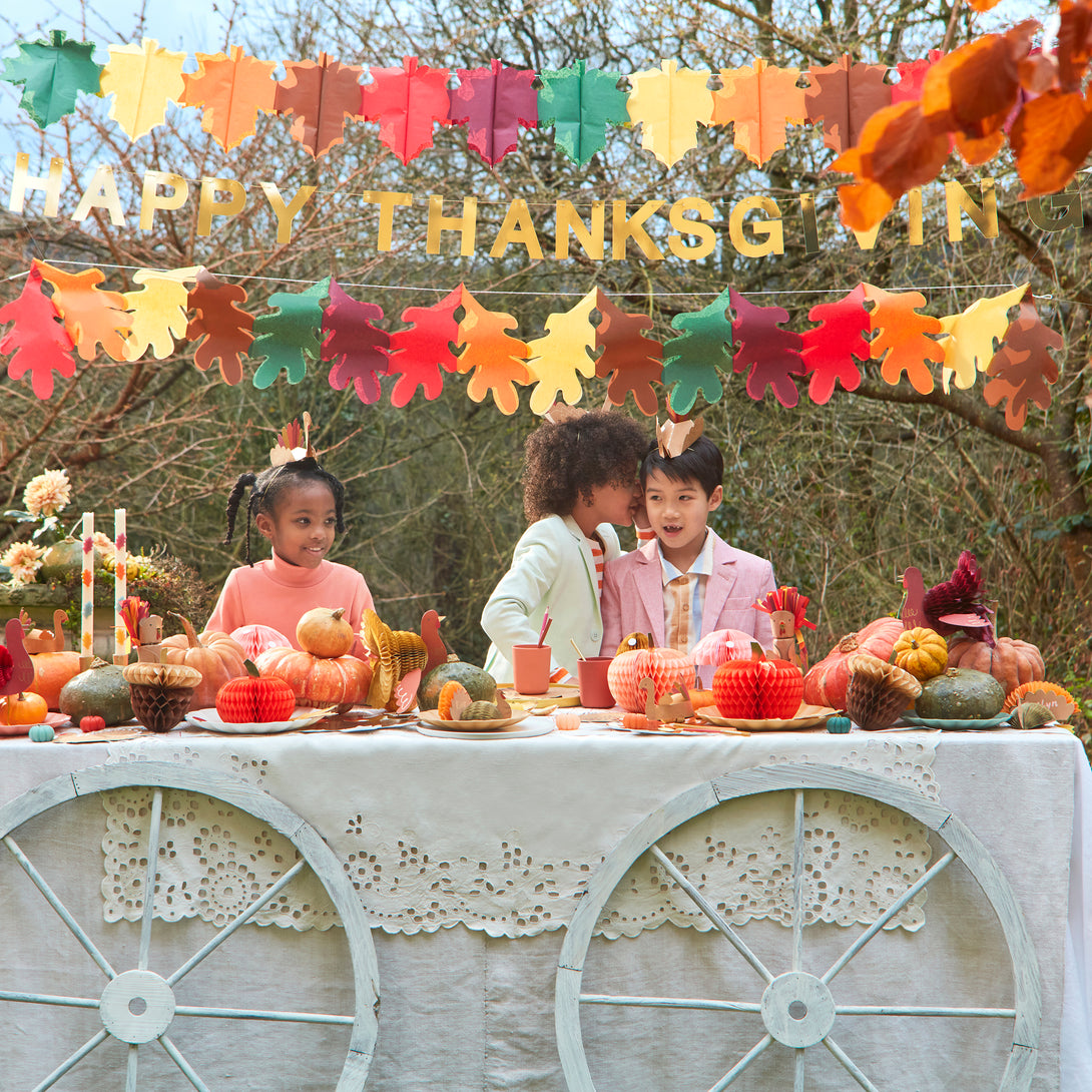 Our Thanksgiving table decorations include honeycomb turkeys, pumpkins, mushrooms and acorns.