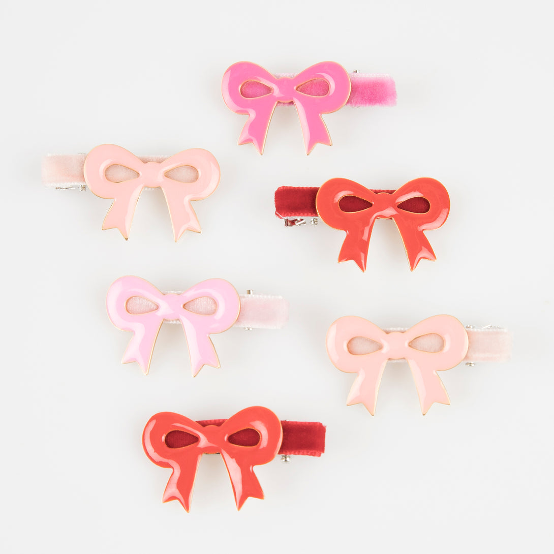 Our luxury red and pink hair clips feature enamel bows and velvet ribbons - the perfect Valentine's hair accessories for kids.