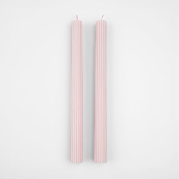 Our tall candles, in a pink color with ridged details, add a stunning look to any party. Image4