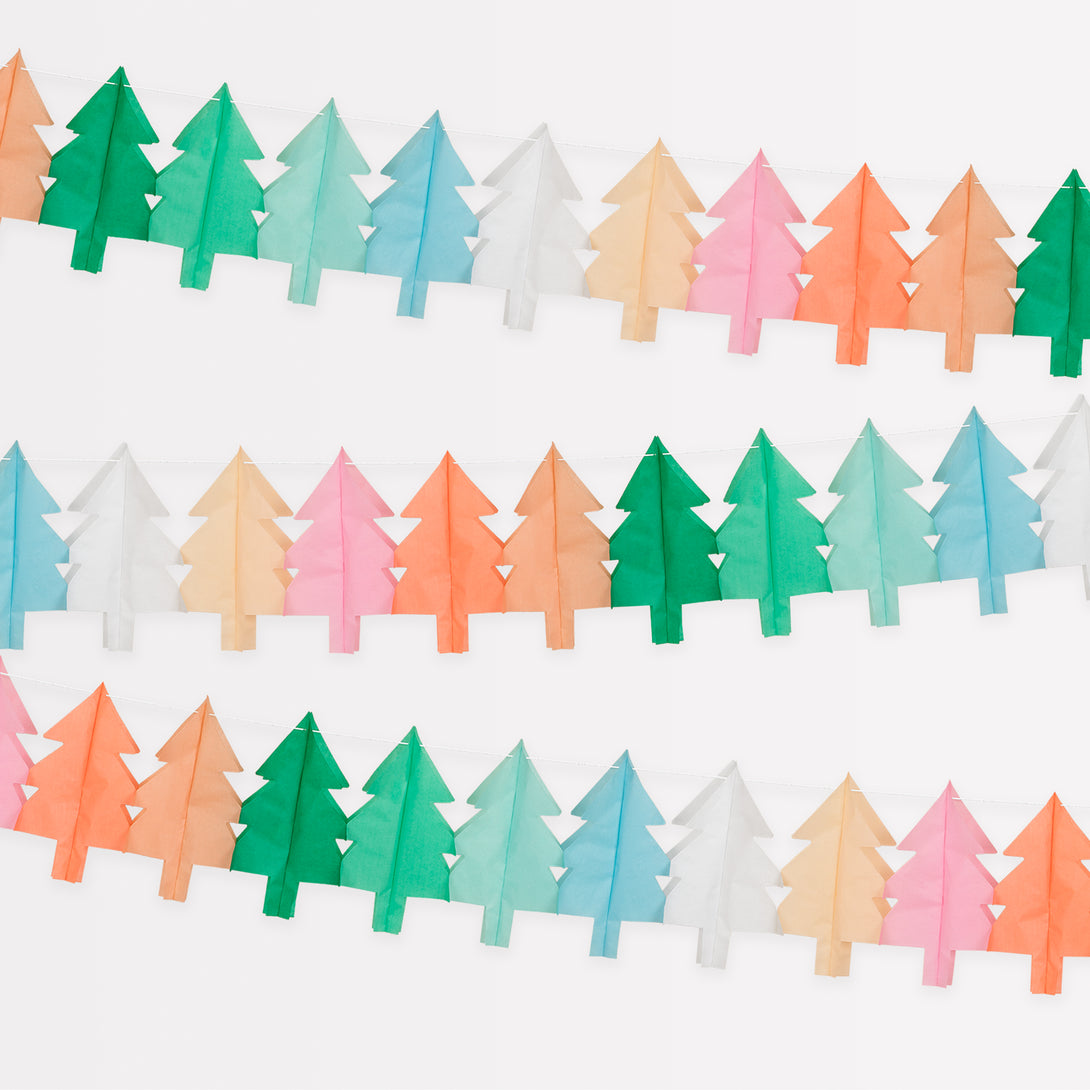 Our hanging Christmas decorations feature tissue paper Christmas trees in lots of colors for a merry and bright look.