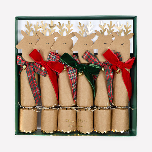 Our Christmas crackers feature reindeer with gold foil antlers and bow details in plaid and velvet, with a joke, party hat and small gift inside. Image1