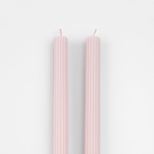 Our tall candles, in a pink color with ridged details, add a stunning look to any party. Image3