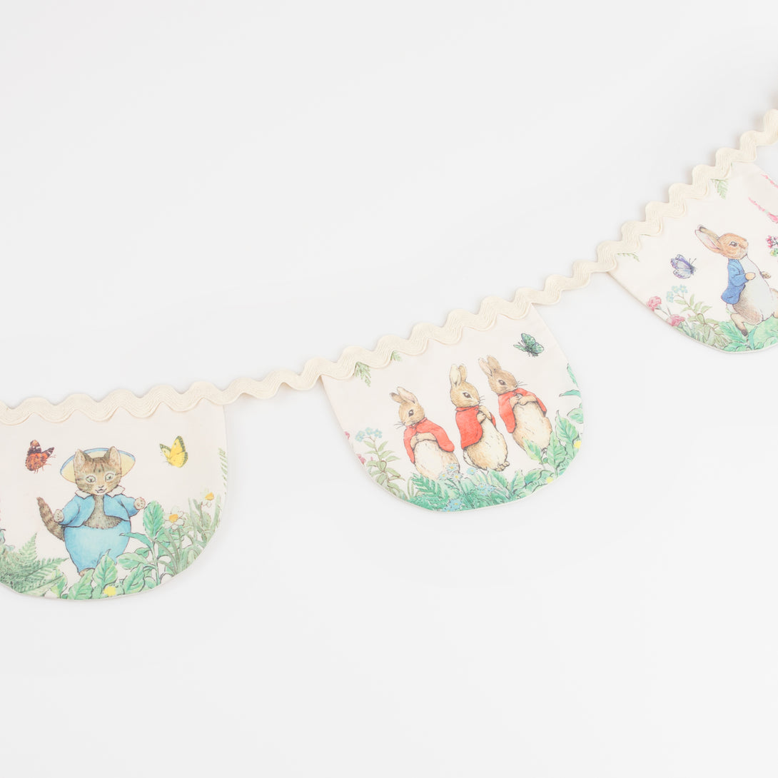 Our Peter Rabbit garland, crafted from fabric, is perfect as a baby shower garland or first birthday garland.