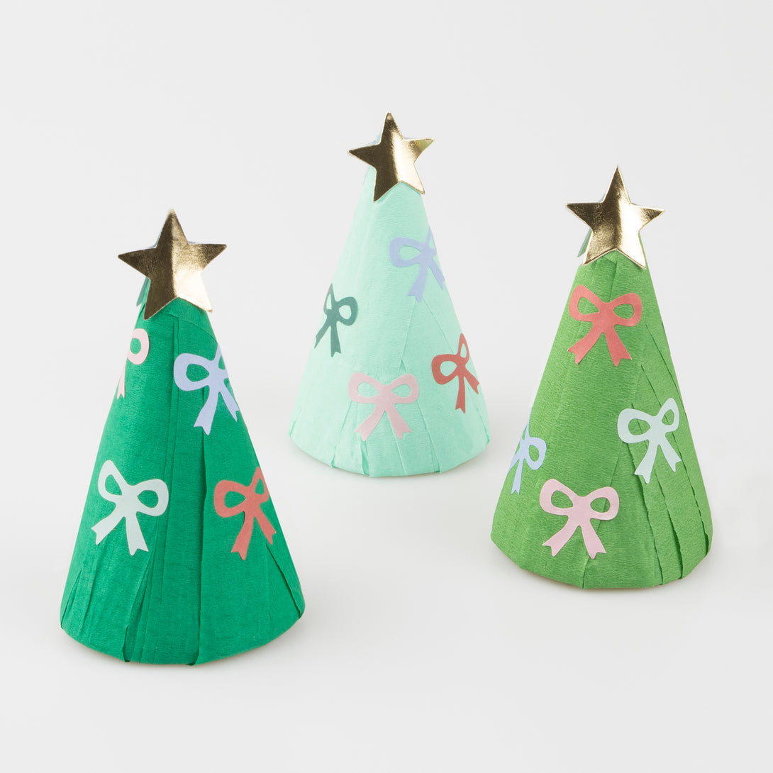 Our Christmas party favors make an amazing Christmas table decoration and include a party hat, jokes, stickers and an enamel charm.