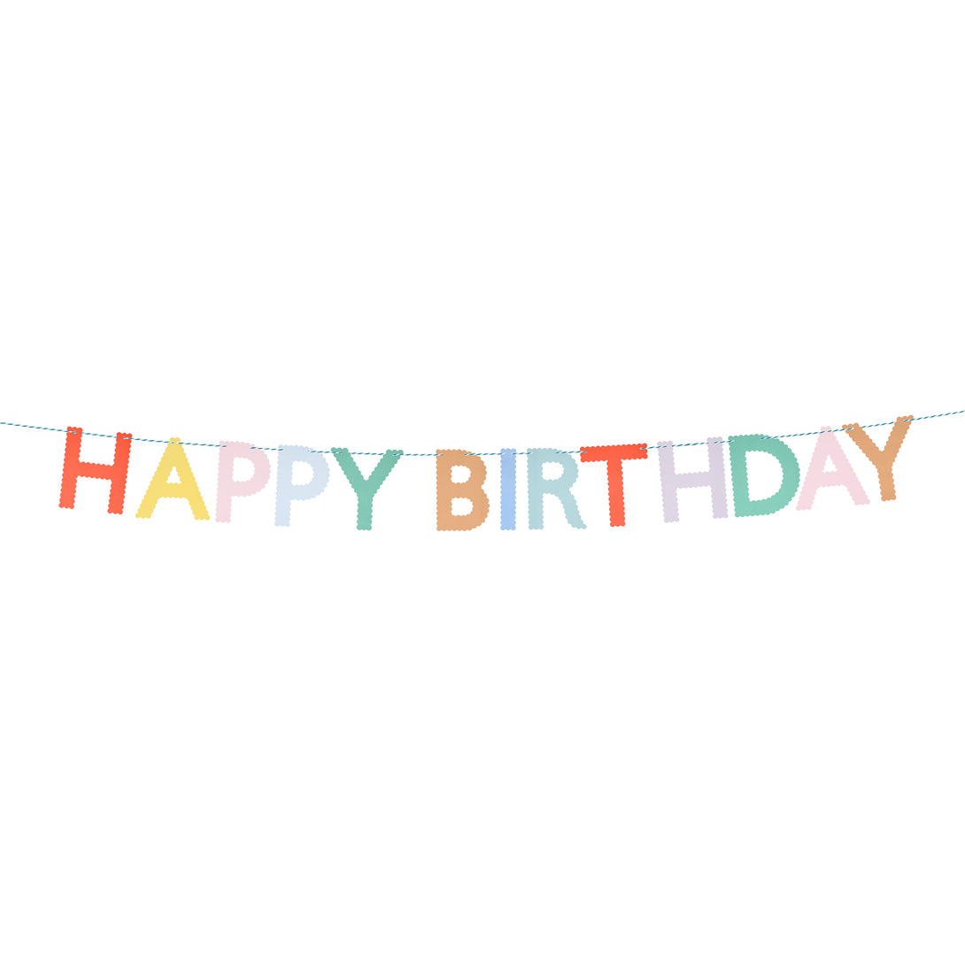 Our Happy Birthday garland, made with bright paper letters with scalloped details, adds a stylish and colorful decoration.