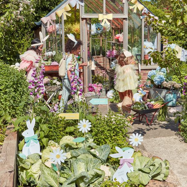 Our special kit includes bunnies with bows and signs with clues to help your kids find their Easter eggs. Image3