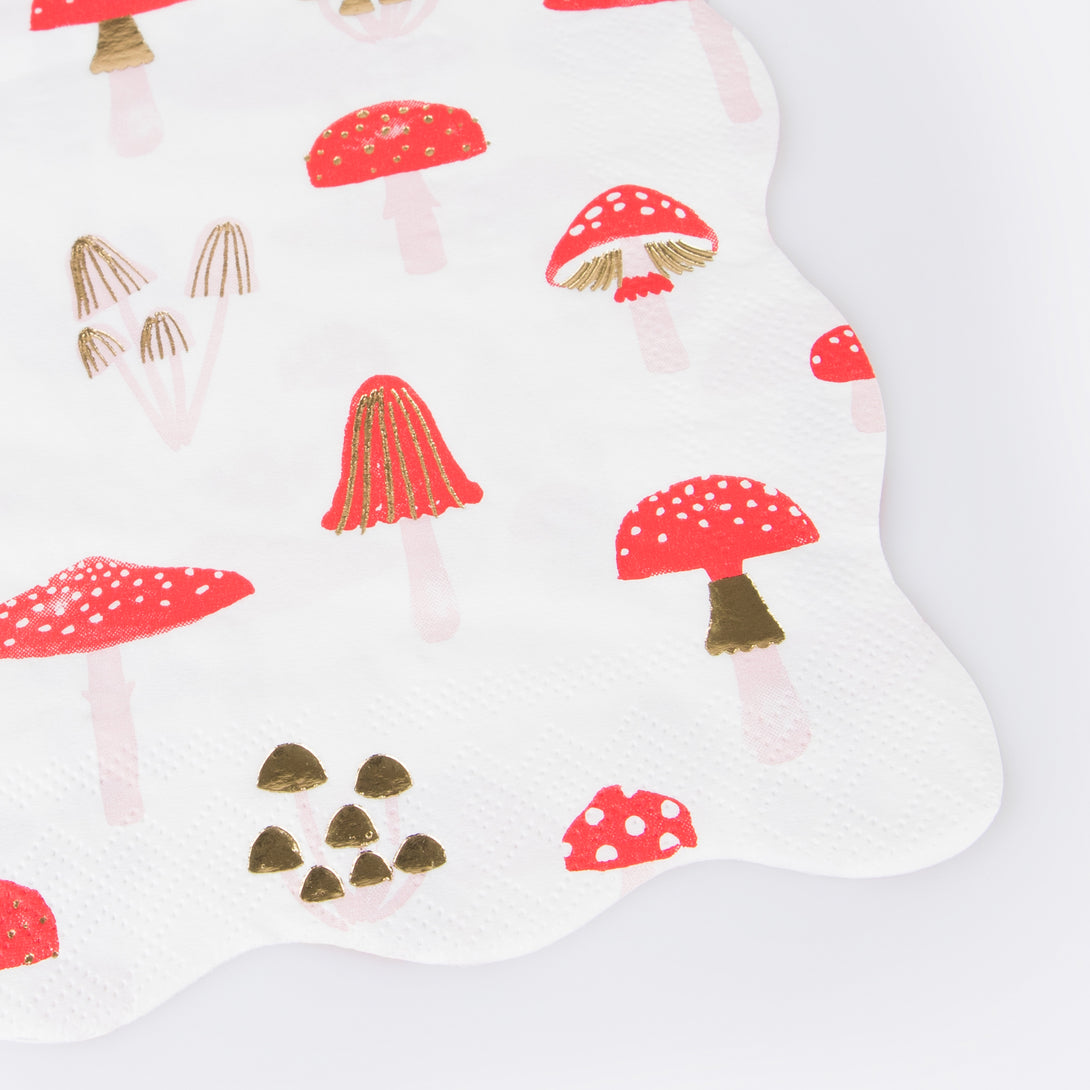 Our special Christmas party supplies include mushrooms and fairy designs on party plates, party napkins and cups, and a festive garland.