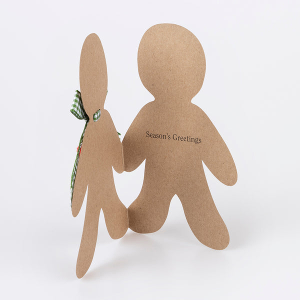 Our Christmas card, in the shape of a gingerbread man with a gingham ribbon bow, makes a great Christmas mantel decoration. Image3