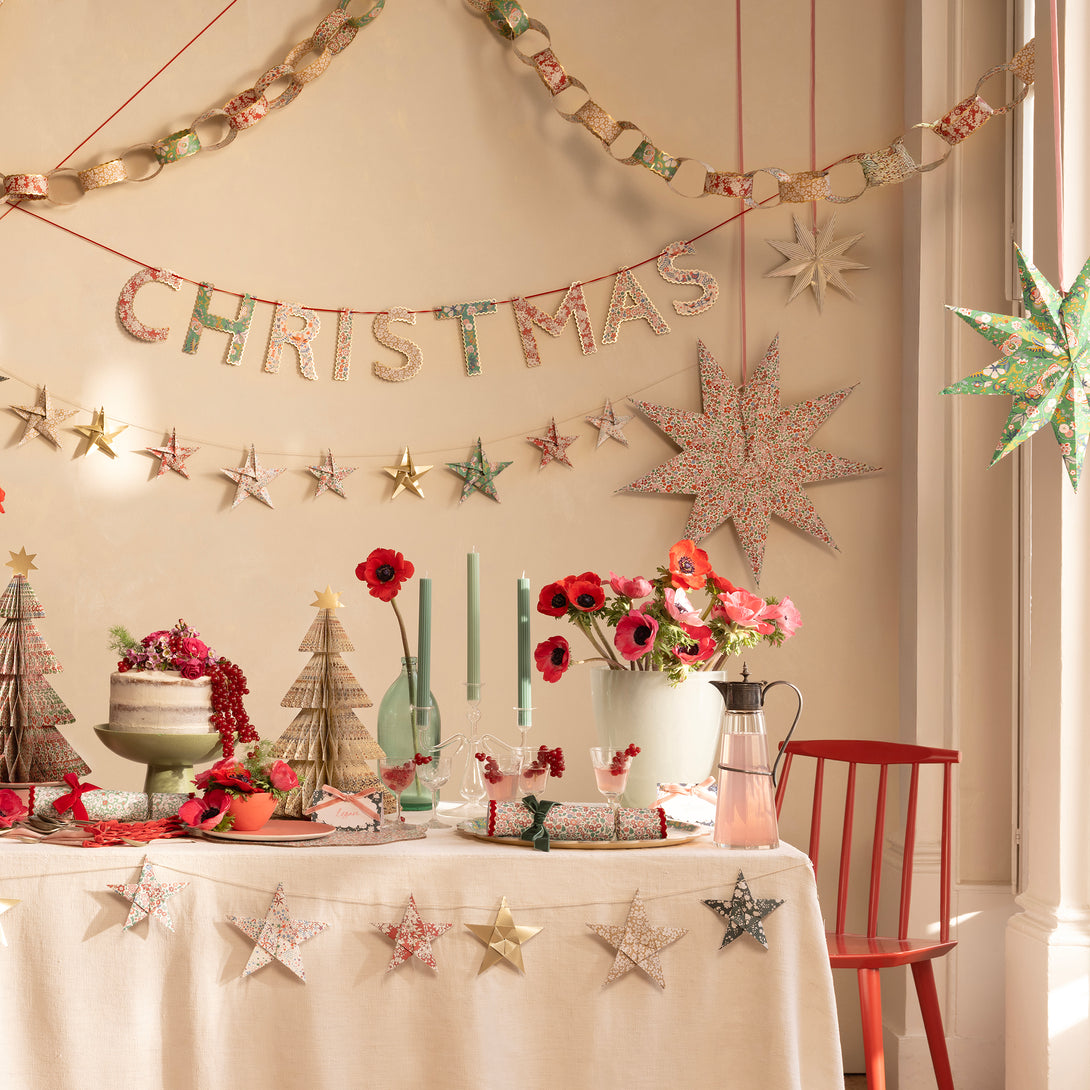 Let our star garland, designed with joyful Liberty star and floral prints and gold foil details, add an elegant touch to your Christmas décor. Image2