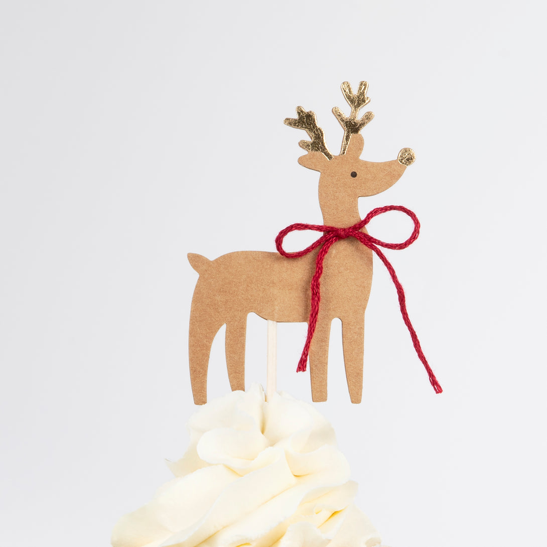 Our special Christmas cupcake kit contains woodland animals, flowers and Christmas tree toppers with striped cupcake cases.