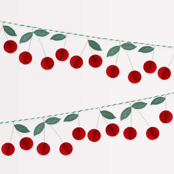 Our paper garland features 3D cherries for a vibrant look, it's perfect as a decoration for a garden party, BBQ or a retro 50s party. Image1