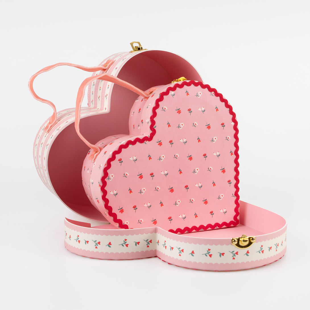 Our kids accessories feature heart suitcases in pink, red and white with soft velvet handles.