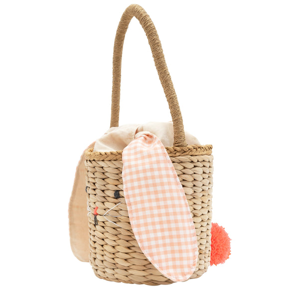 This basket is crafted from woven straw, with floppy ears, a sweet bunny face and a dellightful pompom tail. Image7