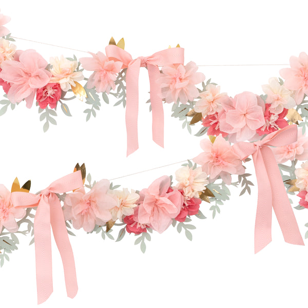 Our elegant paper garland is crafted with paper flowers and pink bows for a really beautiful hanging decoration ideal for a bridal shower. Image1
