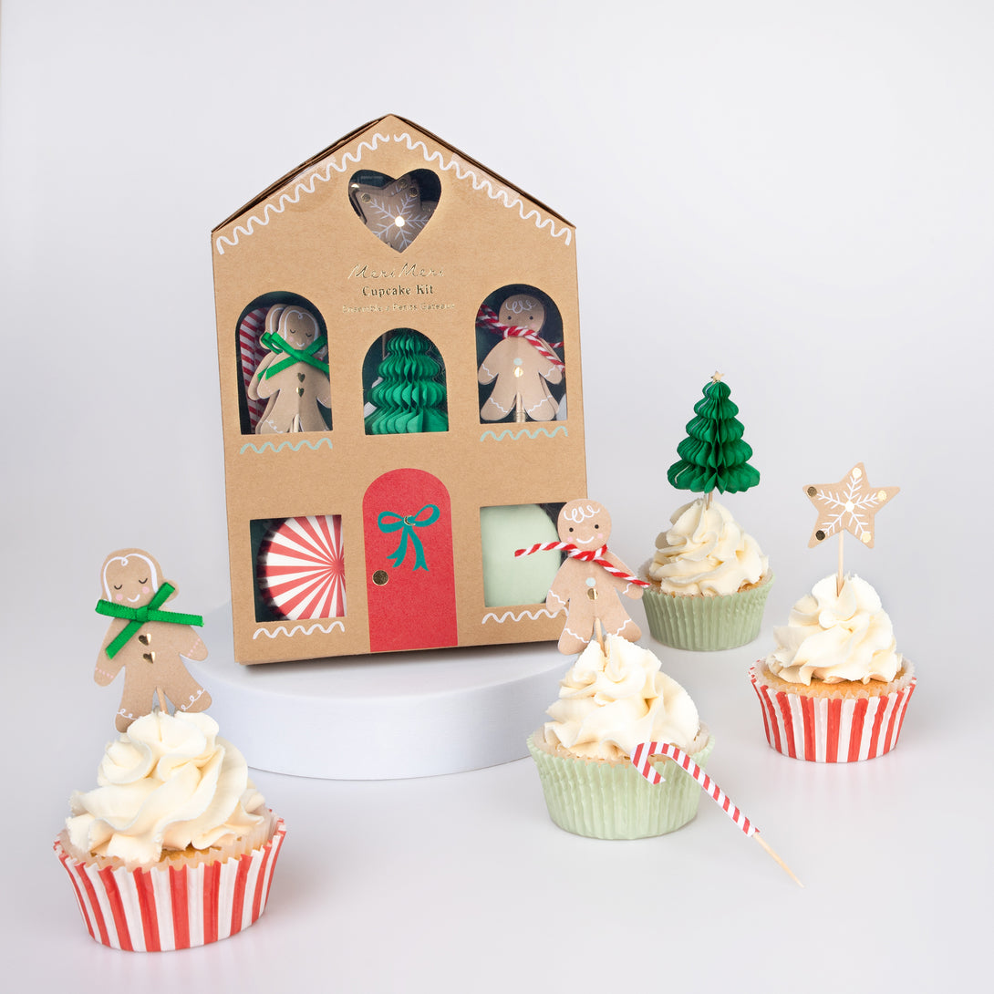 Our special Christmas party supplies include gingerbread house paper plates, party napkins, a cupcake kit and a fabulous festive garland.