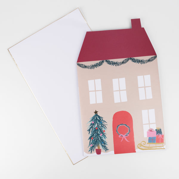 This paper doll house is designed as Santa's home, complete with his reindeer, elves, Christmas tree and gifts. Image5
