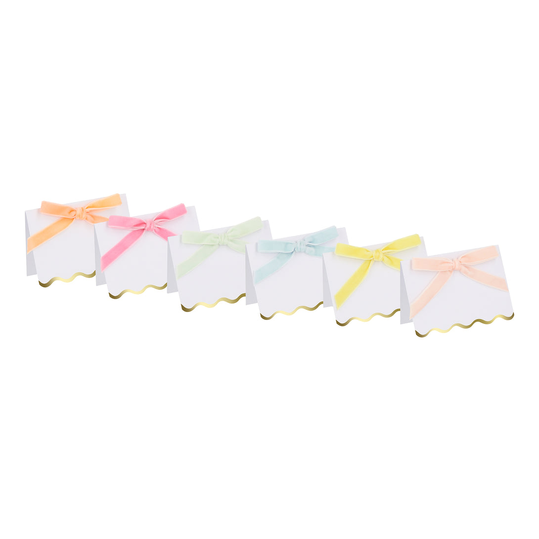 Use our luxury place cards with velvet bows in pastels colors, and shiny gold foil scalloped borders, for special meals like baby showers.