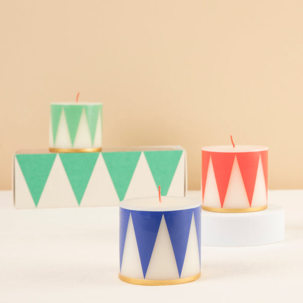 Our Christmas candle set of 3 candles have traditional Nutcracker designs of red, green and blue, with gold details and red wicks.