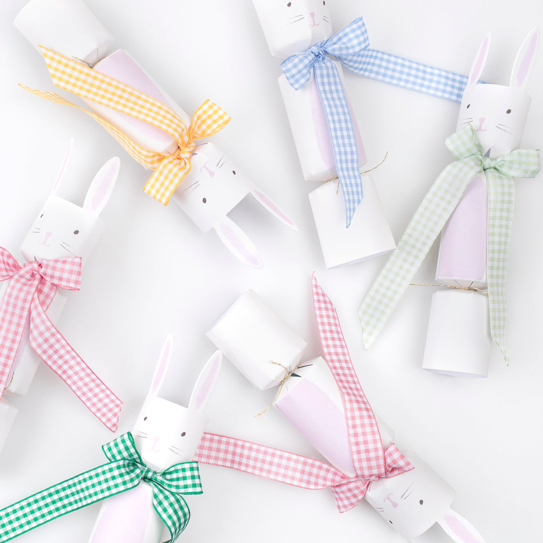 Our party crackers are crafted in the shape of bunnies, and contain mint tissue paper hats, erasers and a joke.