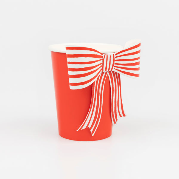 Our disposable red cups feature a festive red and white striped bow, perfect to serve Christmas drinks in. Image3