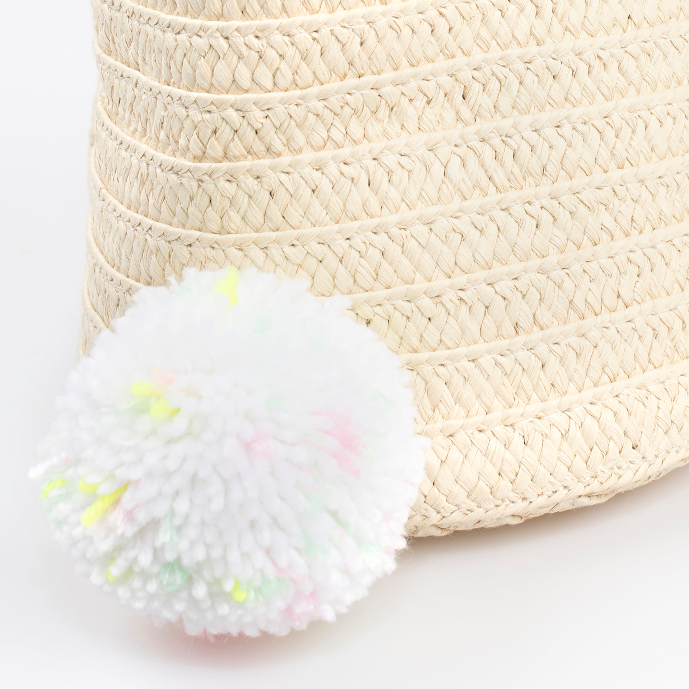 Our Easter bunny basket has a cute face, floppy ears and a pompom tail.