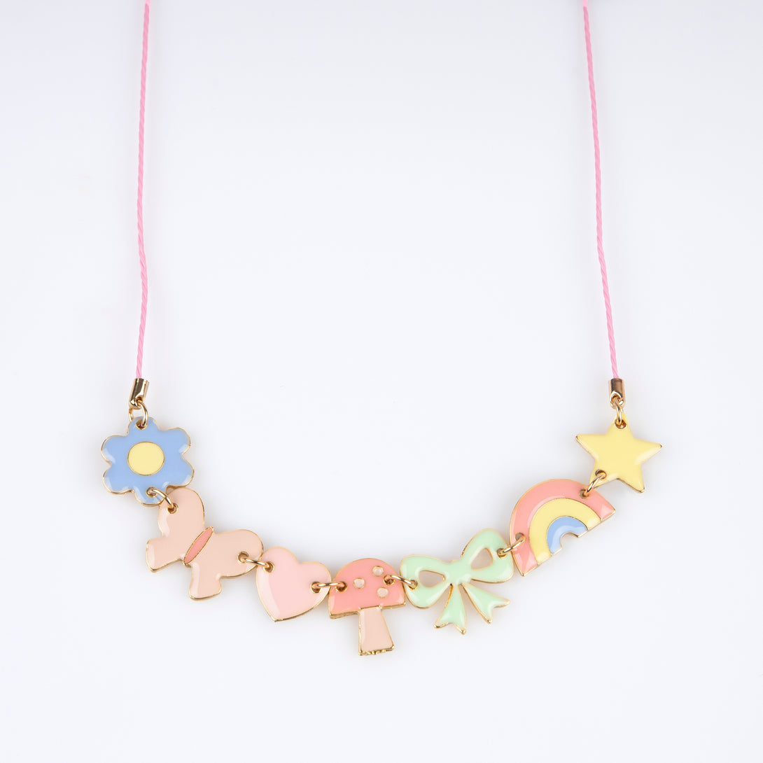 Our charms necklace is crafted with colorful enamel charms with a pink cord and gold tone lobster clasp, a pretty necklace for kids.