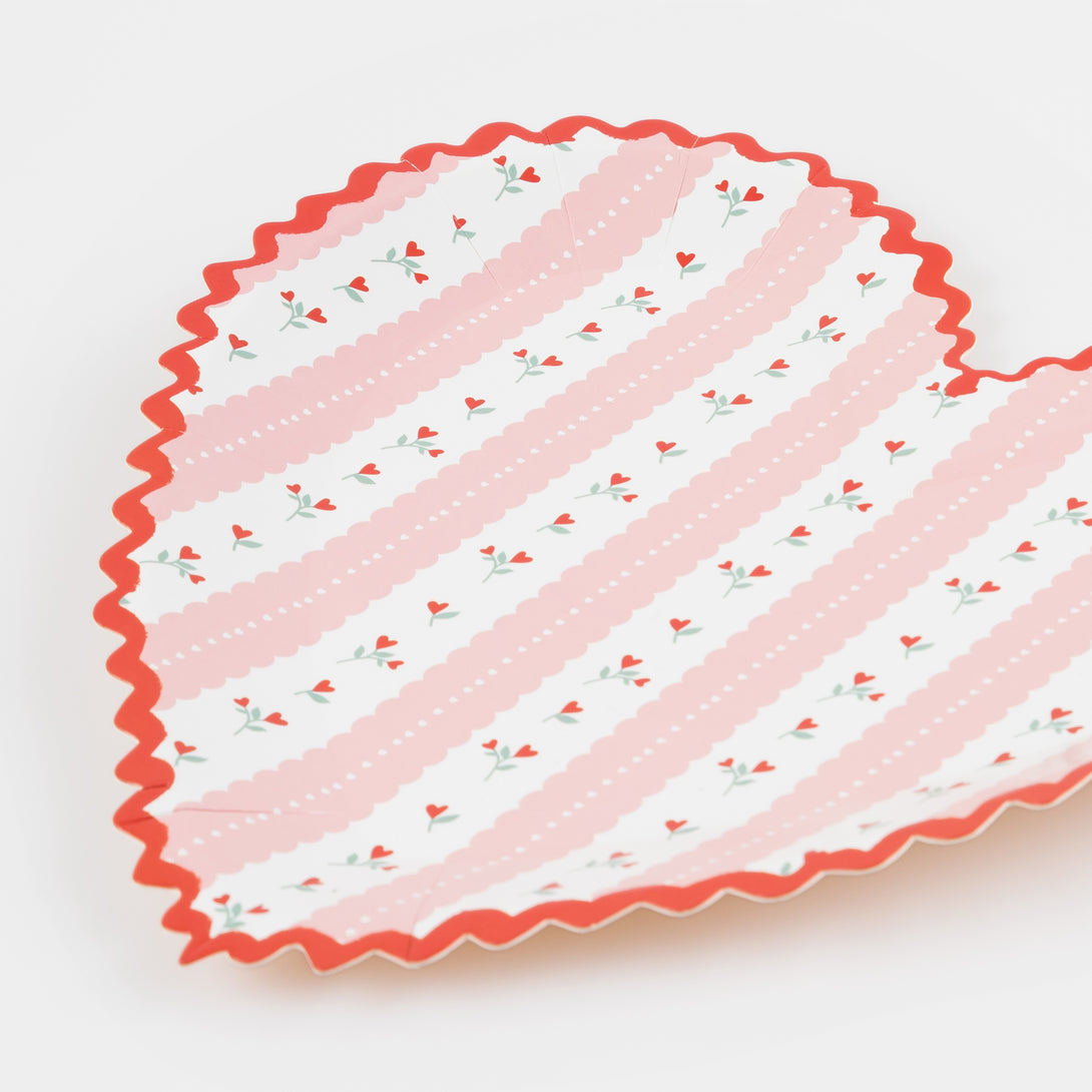 Our pink and red Valentine's plates are heart-shaped and have a pretty floral design.