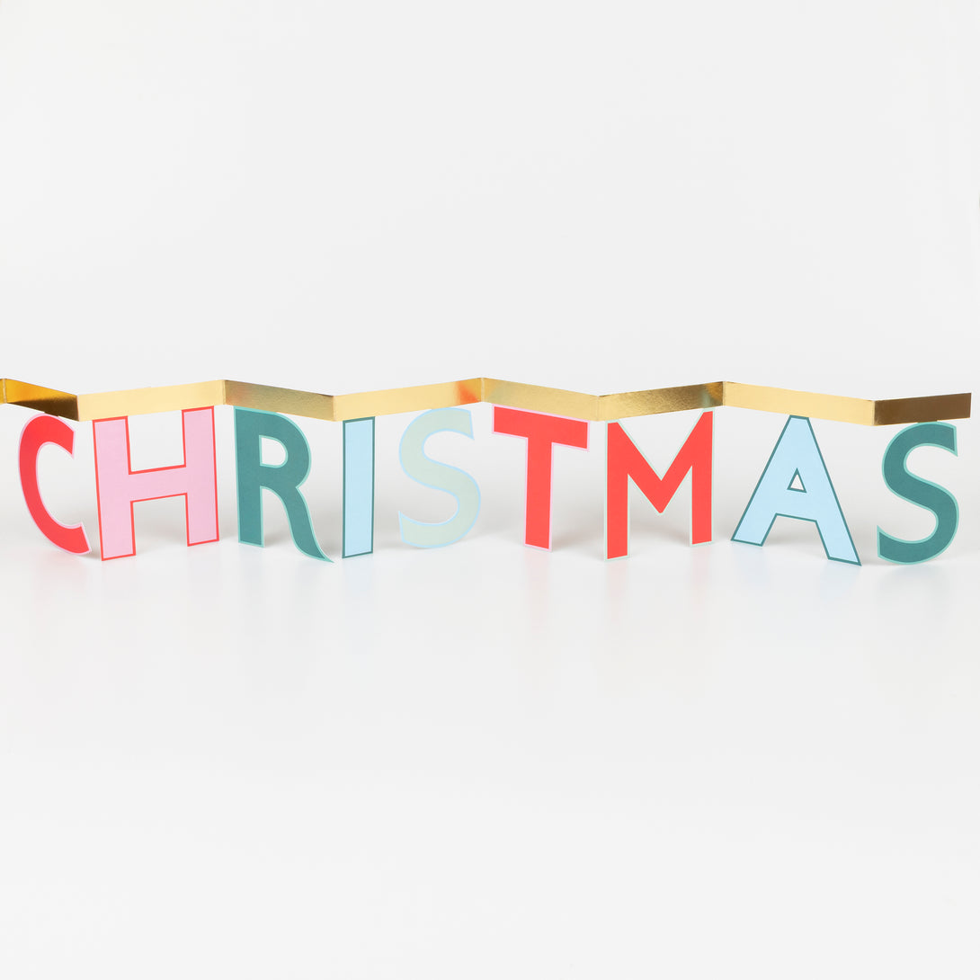 Send festive joy with our cheerful concertina card, it opens to reveal a Merry Christmas message, ideal as a mantel decoration. Image3