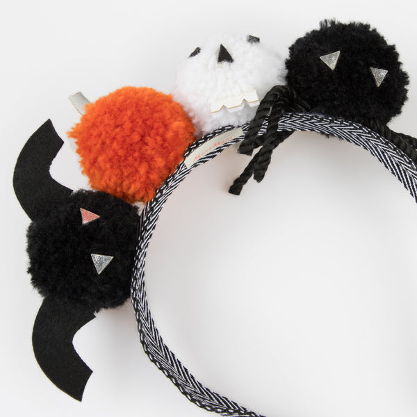 Add our Halloween headband, with fun pom pom details, to your Halloween accessories for a thrilling look. Image3